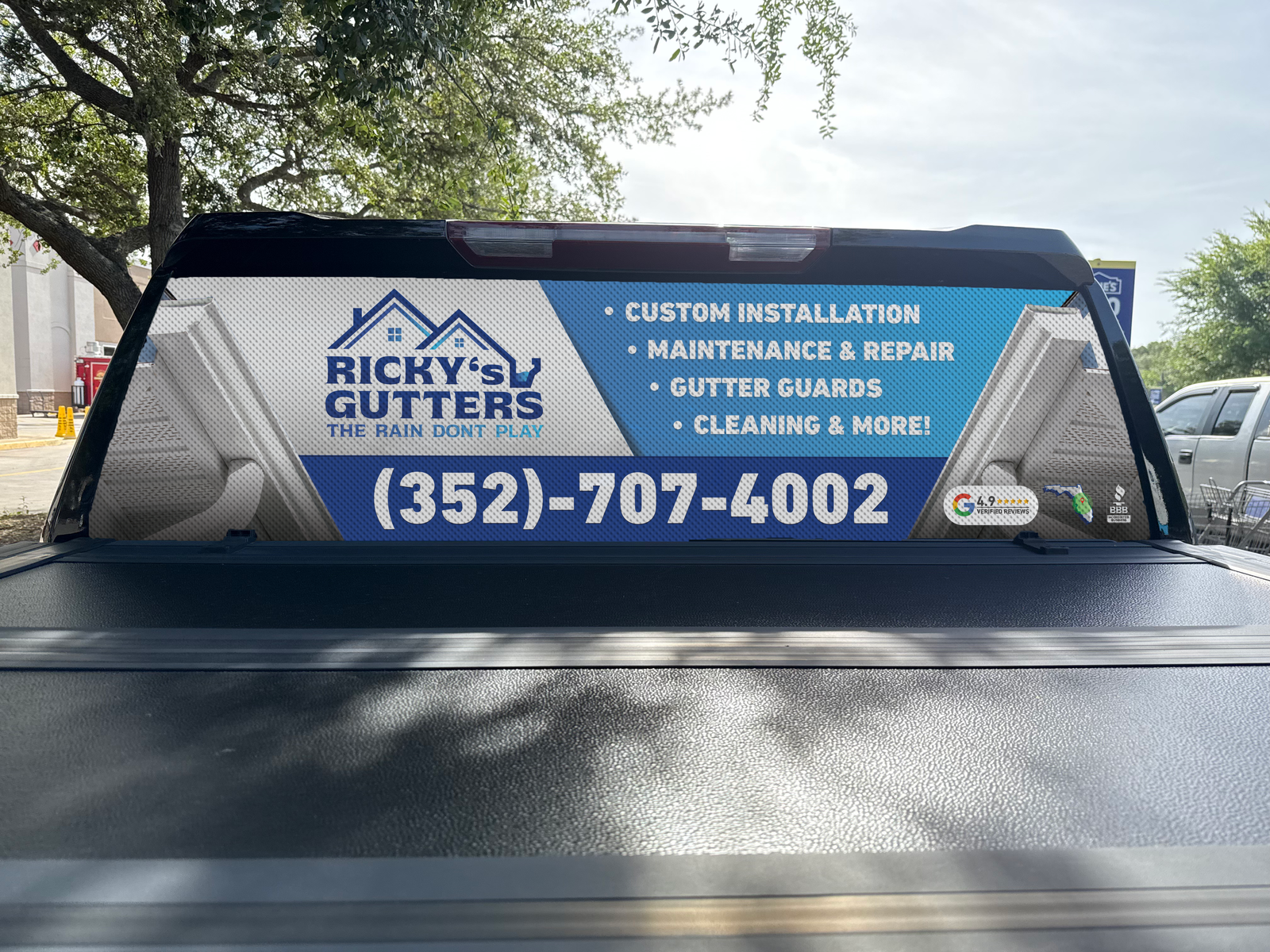 Ricky's Gutters truck rear-window graphic