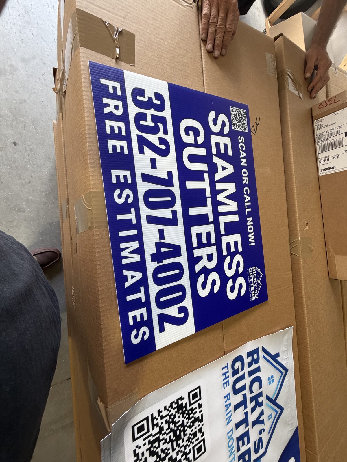 Ricky's Gutters yard sign installed in a yard