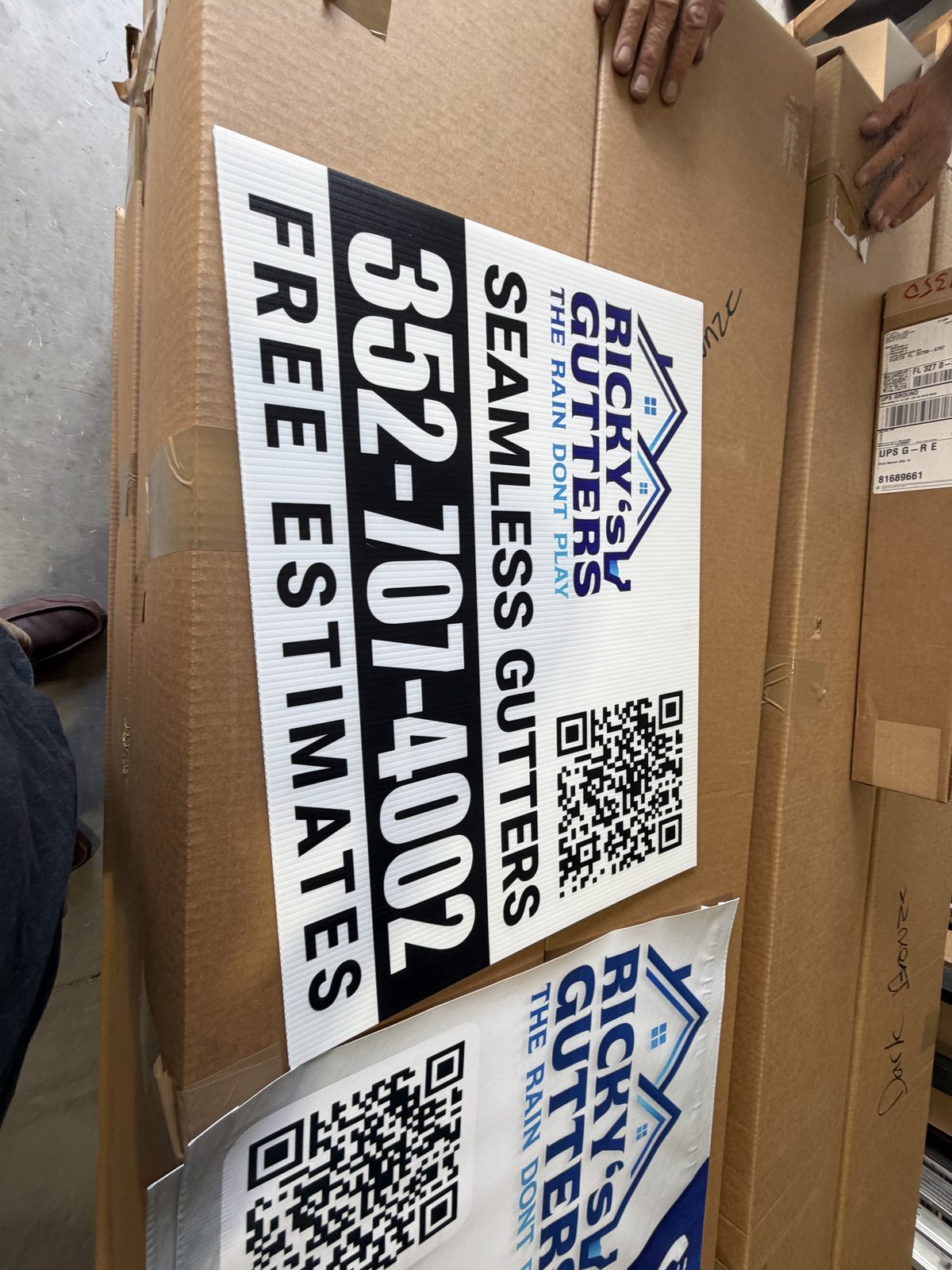 Ricky's Gutters yard sign installed in a yard